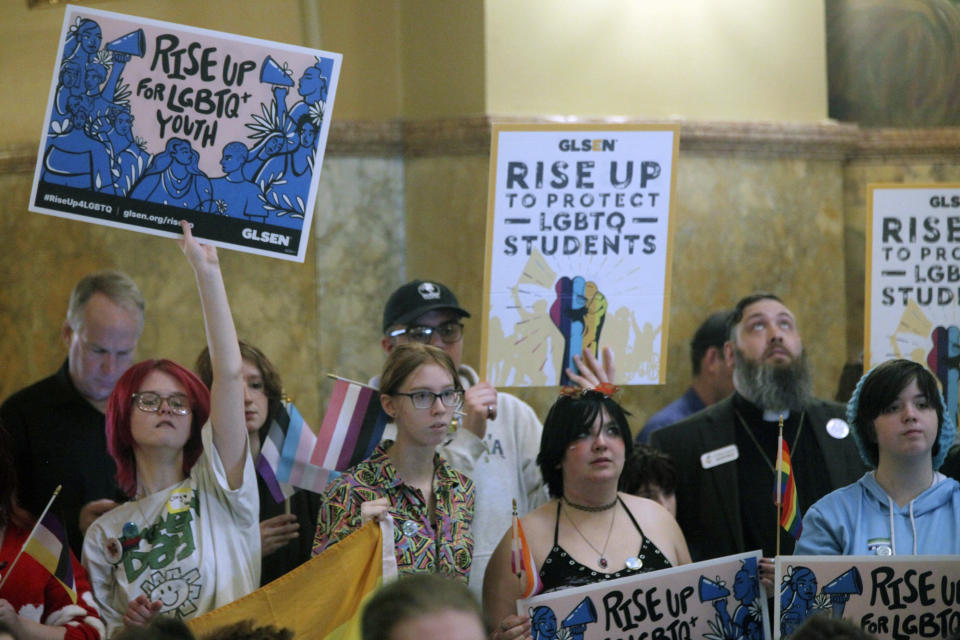 FILE - Kansas high school students, family members and advocates rally for transgender rights, Wednesday, Jan. 31, 2024, at the Statehouse in Topeka, Kan. Kansas enacted a law last year that ended legal recognition of transgender identities. The measure says there are only two sexes, male and female, that are based on a person’s “biological reproductive system" at birth. (AP Photo/John Hanna, File)