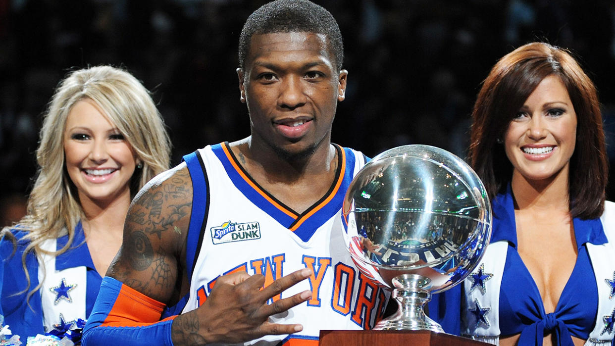 Nate Robinson his pictured holding the third of his three slam dunk contest trophies, which he won in 2010.