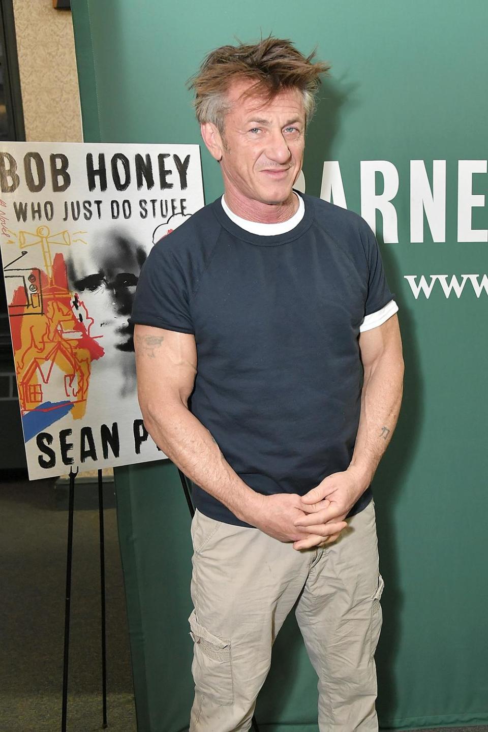 Panned: Sean Penn posing with the cover of his debut novel (Michael Loccisano/Getty)