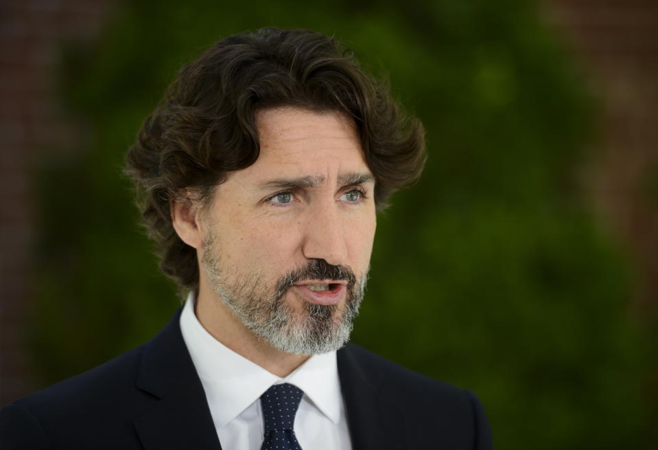 Prime Minister Justin Trudeau holds a press conference at Rideau Cottage during the COVID-19 pandemic in Ottawa on Friday, June 5, 2020. (Sean Kilpatrick/The Canadian Press via AP)