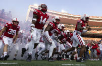 Nebraska players run onto the field before playing against Northern Illinois during an NCAA college football game, Saturday, Sept. 16, 2023, in Lincoln, Neb. (AP Photo/Rebecca S. Gratz)