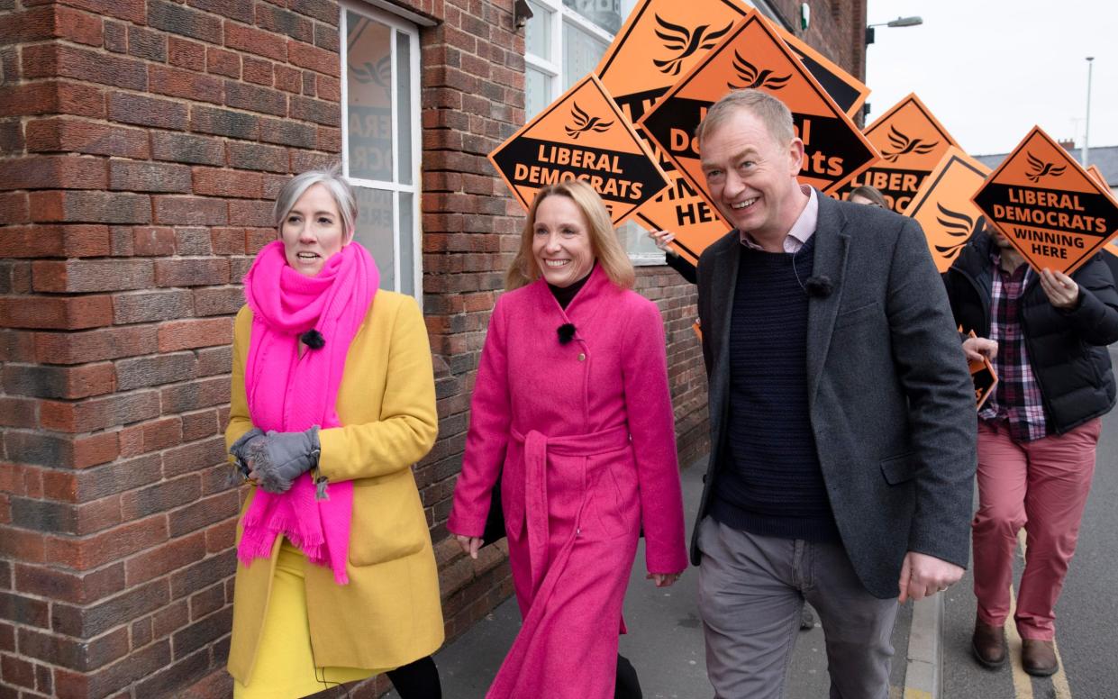 Liberal Democrat candidate Helen Morgan (centre) walking through the town of Oswestry the morning after her win - Andrew Fox 