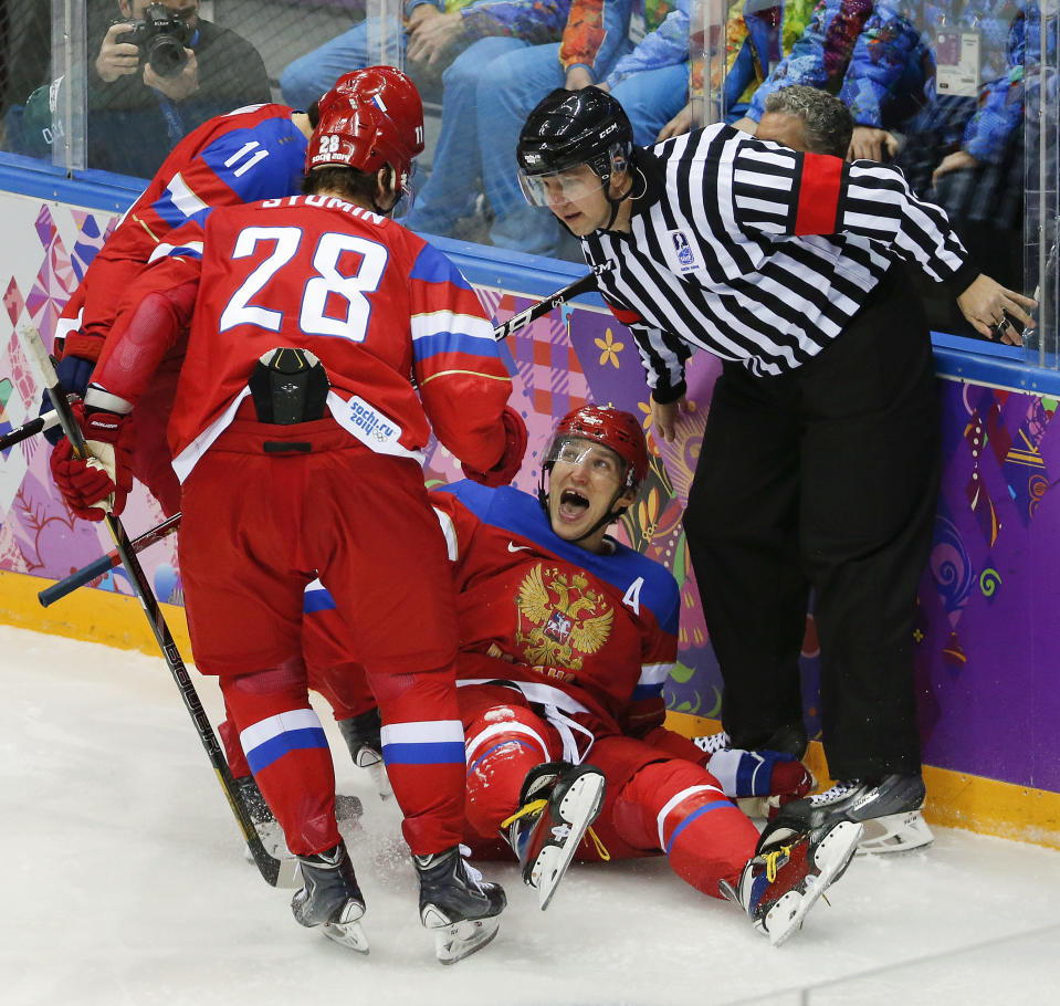 Russia forward Alexander Ovechkin reacts with forward Alexander Syomin and forward Yevgeni Malkin after scoring a goal against Slovenia in the first period of a men's ice hockey game at the 2014 Winter Olympics, Thursday, Feb. 13, 2014, in Sochi, Russia. (AP Photo/Mark Humphrey, File)