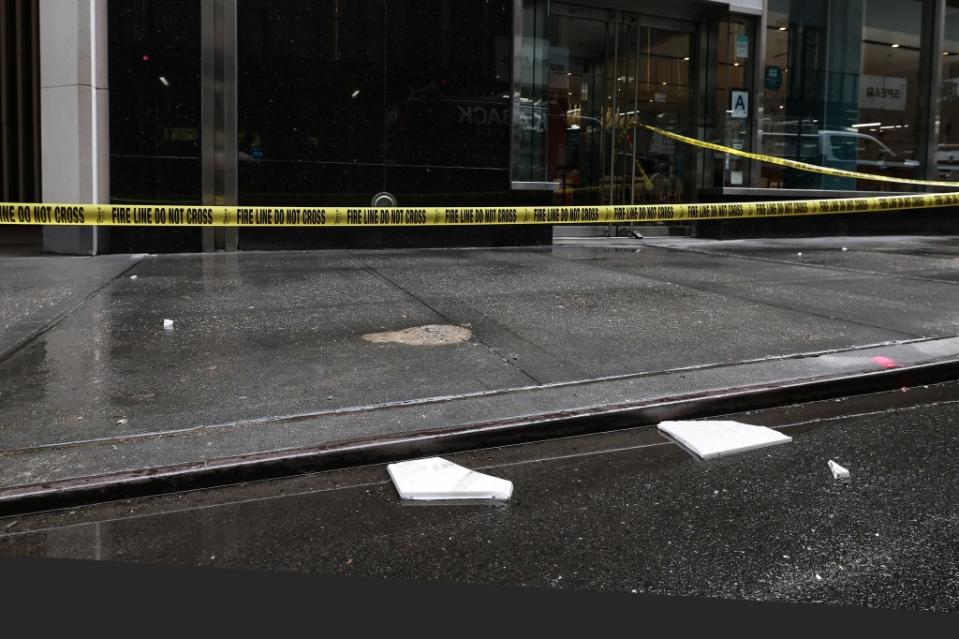 Shards of tile blown off a building on a sidewalk in Manhattan. William Farrington