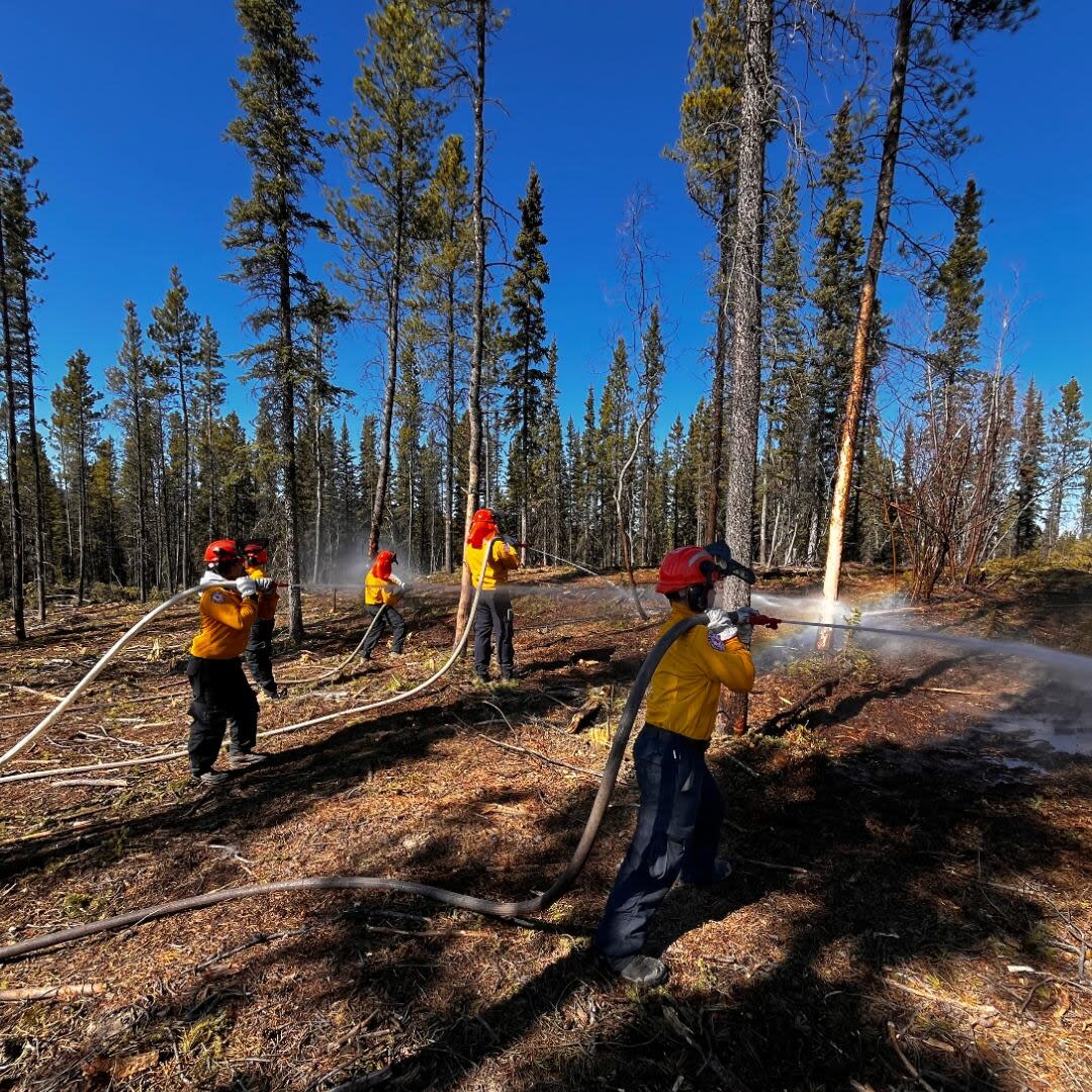 Students getting some hands-on firefighting practice during this week's 'Beat the Heat' training program in Whitehorse.  (Supplied/Yukon First Nations Wildfire - image credit)