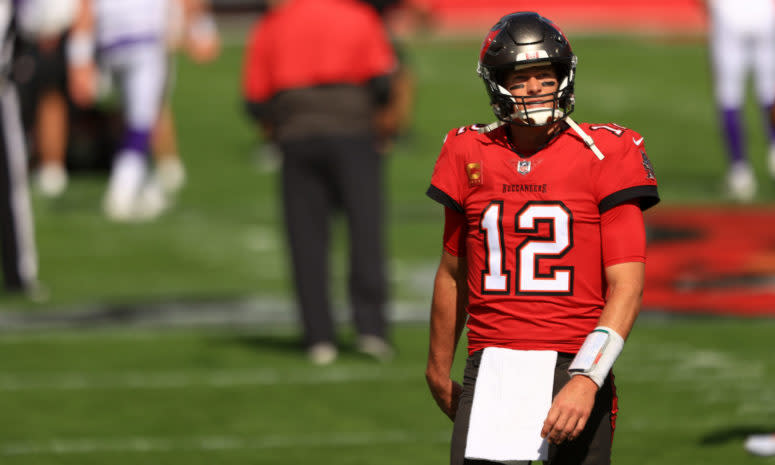 Tom Brady #12 of the Tampa Bay Buccaneers warms up before their game against the Minnesota Vikings