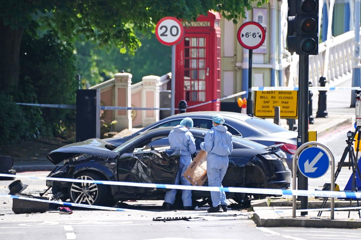 Police forensic officers at the scene at Cheyne Walk in Chelsea, London (PA)