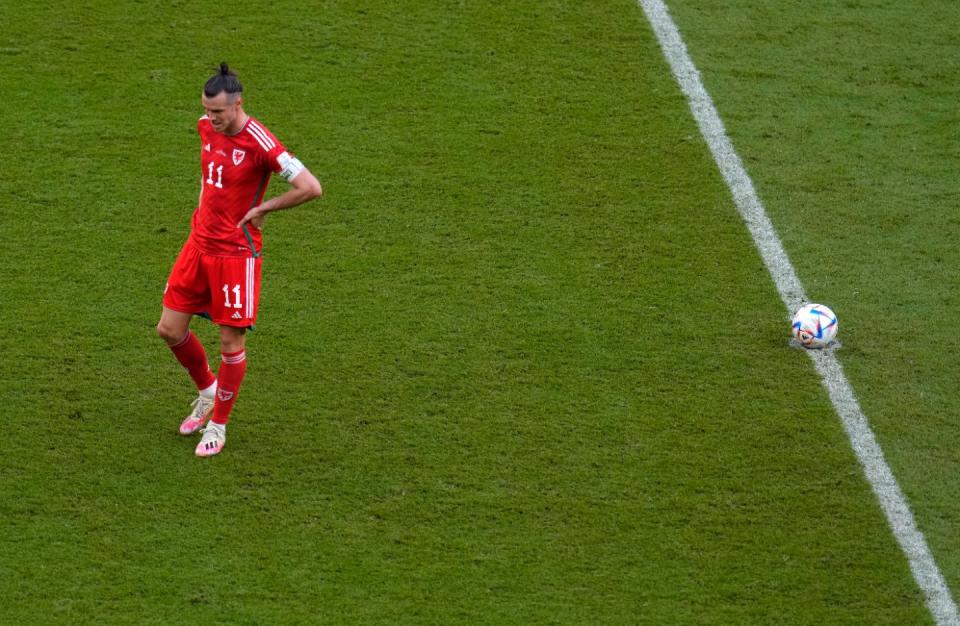 Wales' Gareth Bale reacts after Iran's Ramin Rezaeian scoring his side's second goal during the World Cup group B football match between Wales and Iran, at the Ahmad Bin Ali Stadium in Al Rayyan , Qatar, Friday, Nov. 25, 2022. (AP Photo/Manu Fernandez)