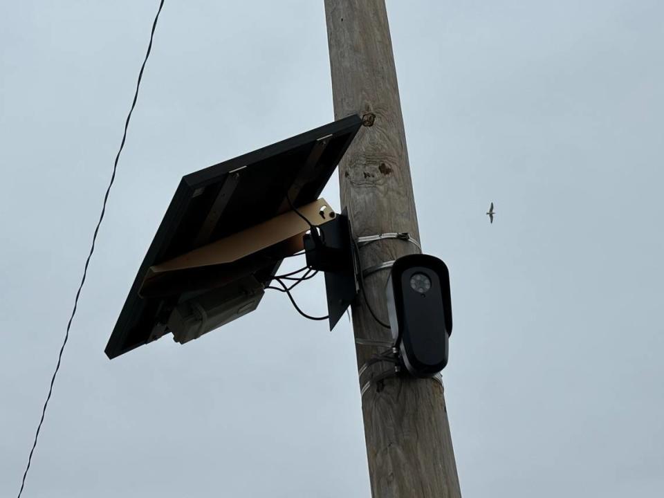 A Flock Safety license plate reading camera sits on a pole near Echo Lake in south-central Fort Worth in this photo taken on March 15, 2024.