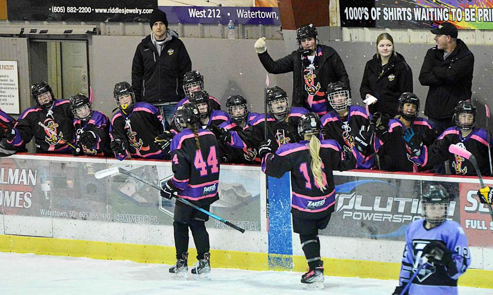 The Watertown Lakers' bench congratulates Emma Schleusner (44) after she scored a goal during a South Dakota Amateur Hockey Association varsity girls hockey game against Rushmore on Saturday, Jan. 20, 2024 in the Maas Ice Arena. The Thunder won 6-3.