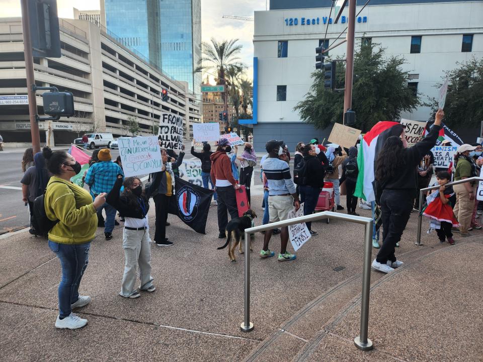 Pro-Palestinian supporters rallying against the Israel-Hamas conflict gather outside of The Arizona Republic on the corner of Van Buren Street and 2nd Street.