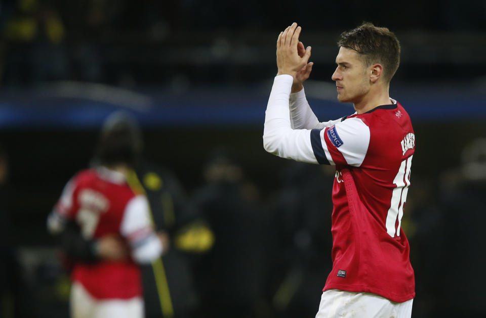 Arsenal's Aaron Ramsey celebrates after defeating Borussia Dortmund in their Champions League Group F soccer match in Dortmund November 6, 2013. REUTERS/Wolfgang Rattay (GERMANY - Tags: SPORT SOCCER)