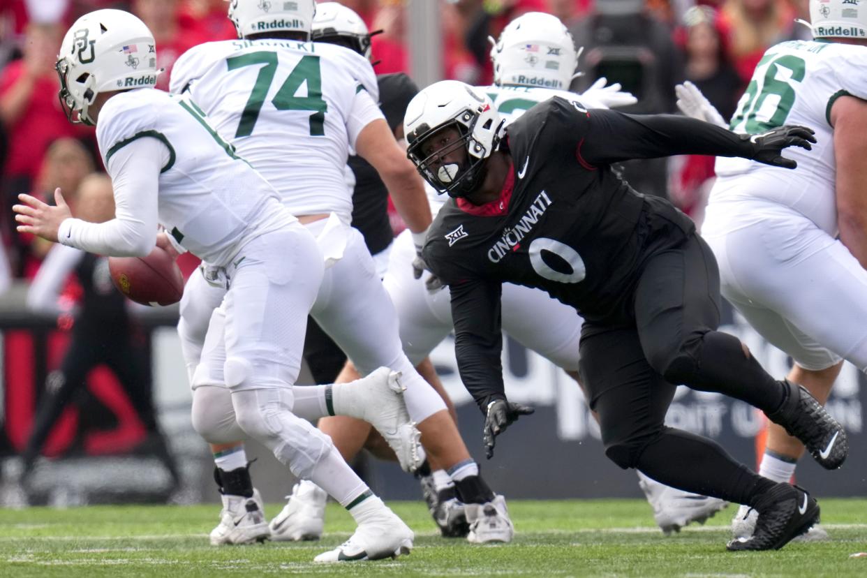 Cincinnati Bearcats defensive end Jowon Briggs (0) pressures Baylor Bears quarterback Blake Shapen (12) in the XX quarter during a college football game between the Baylor Bears and the Cincinnati Bearcats, Saturday, Oct. 21, 2023, at Nippert Stadium in Cincinnati.