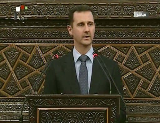 An image grab taken from Syrian state TV shows Syrian President Bashar al-Assad addressing the parliament in Damascus. Assad on Sunday dismissed allegations that his government had a hand in the Houla massacre and accused foreign-backed forces of plotting to destroy Syria