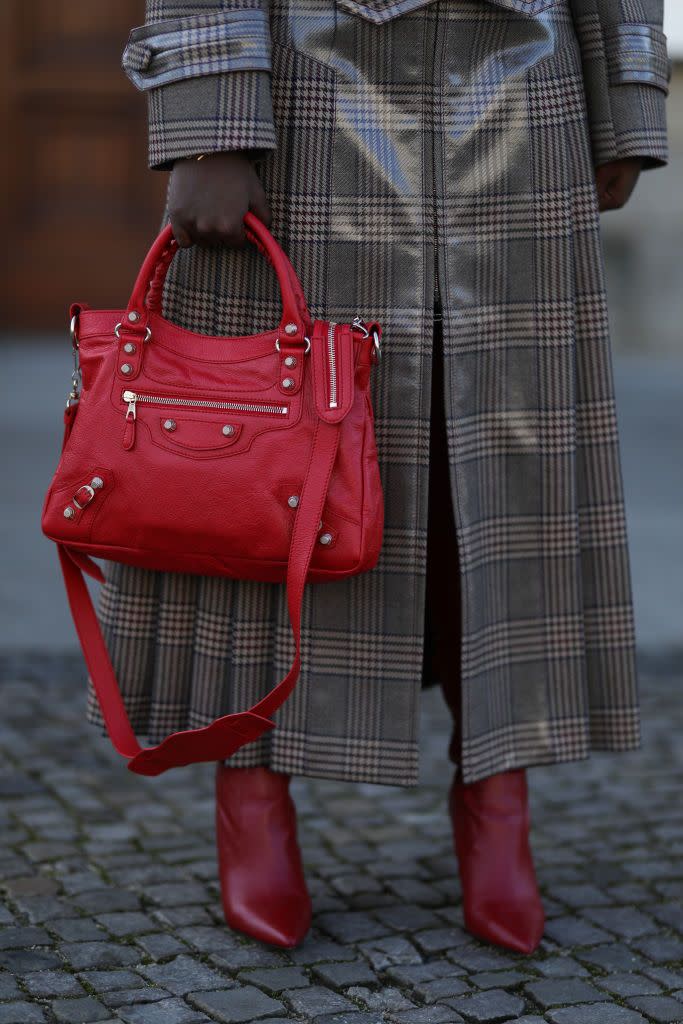 berlin, germany january 27 lois opoku wearing fendi brown coat, red aldo overknees and balenciaga red bag on january 27, 2021 in berlin, germany photo by jeremy moellergetty images