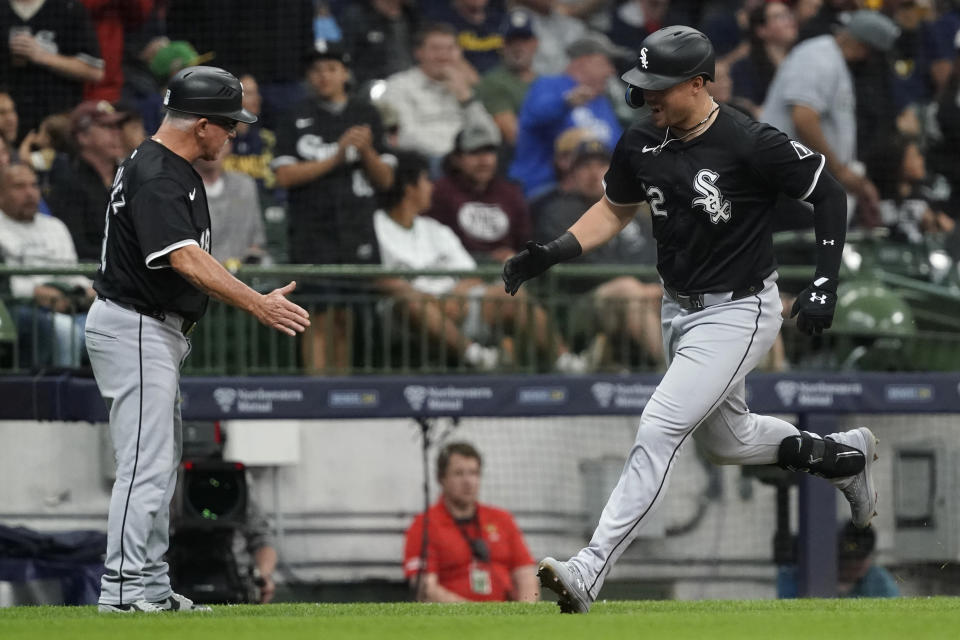 Chicago White Sox's Gavin Sheets, right, is congratulated by third base coach Eddie Rodriguez after hitting a two-run home run during the fourth inning of a baseball game against the Milwaukee Brewers Saturday, June 1, 2024, in Milwaukee. (AP Photo/Aaron Gash)