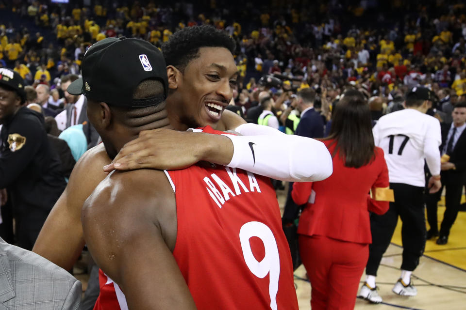 OAKLAND, CALIFORNIA - JUNE 13: Malcolm Miller #13 and Serge Ibaka #9 of the Toronto Raptors celebrates his teams win victory over the Golden State Warriors in Game Six to win the 2019 NBA Finals at ORACLE Arena on June 13, 2019 in Oakland, California. NOTE TO USER: User expressly acknowledges and agrees that, by downloading and or using this photograph, User is consenting to the terms and conditions of the Getty Images License Agreement. (Photo by Ezra Shaw/Getty Images)