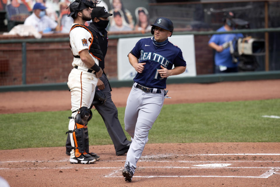 Seattle Mariners' Kyle Seager (15) scores on an RBI single by Tim Lopes during the second inning of a baseball game against the San Francisco Giants, Thursday, Sept. 17, 2020 in San Francisco. (AP Photo/D. Ross Cameron)