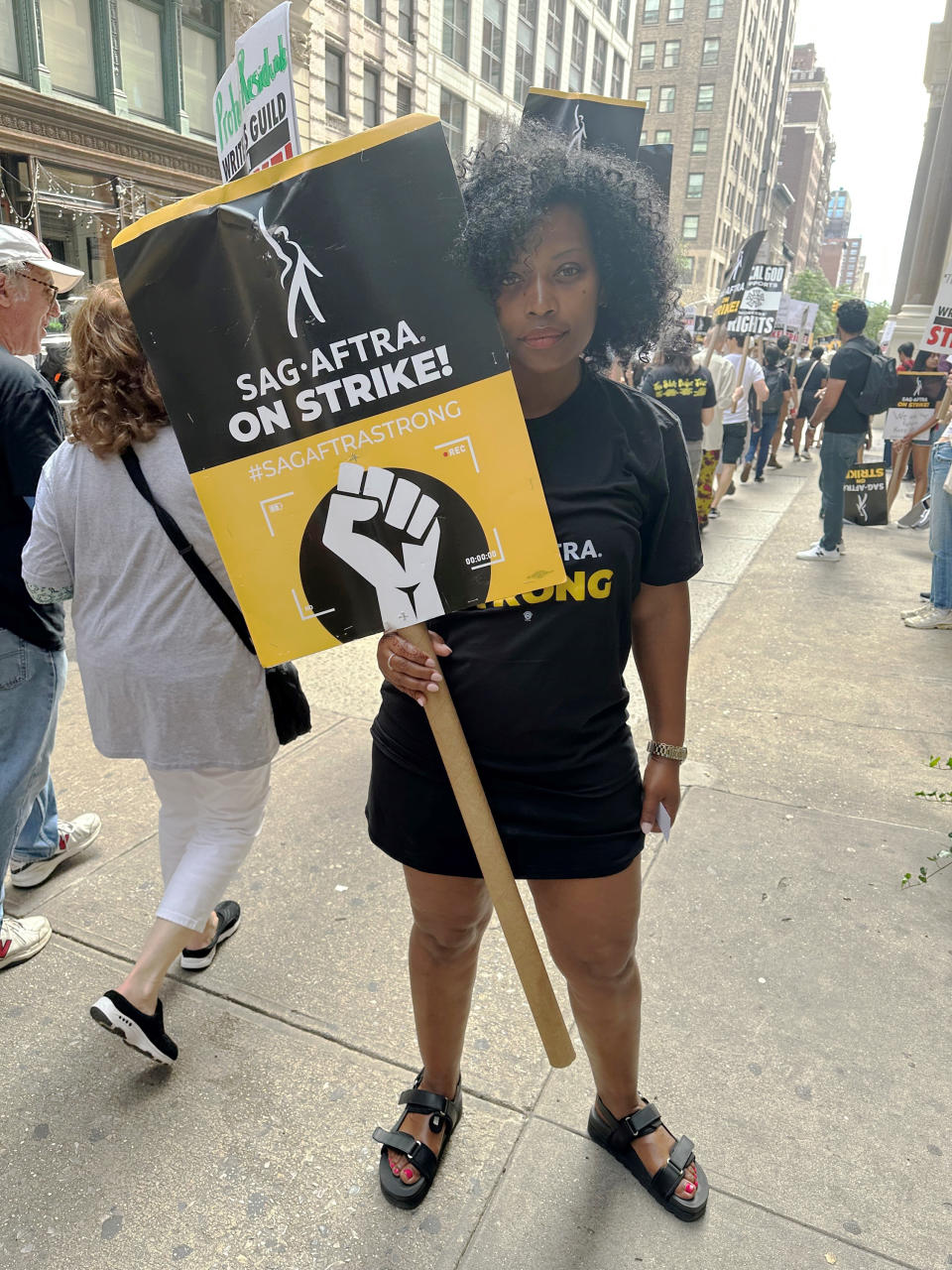 Actor Bethany Layla Johnson appears on a New York City picket line on Aug. 23, 2023. Johnson is one of thousands of entertainment industry workers forced by the Hollywood contract fights to find outside work. (Leanne Italie via AP)