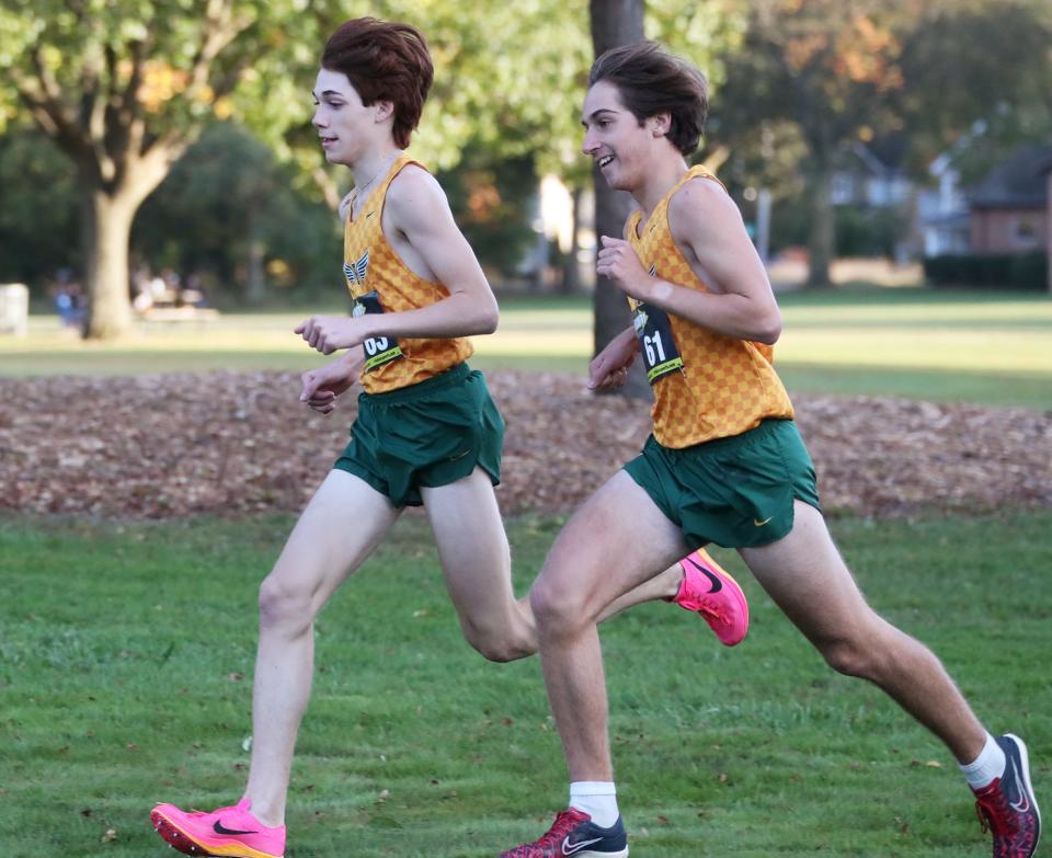 Firestone's Eli Dunlap, left, and David Burkholder run together in the City Series cross country championship at Goodyear Heights Metro Park, Oct. 11, 2023.