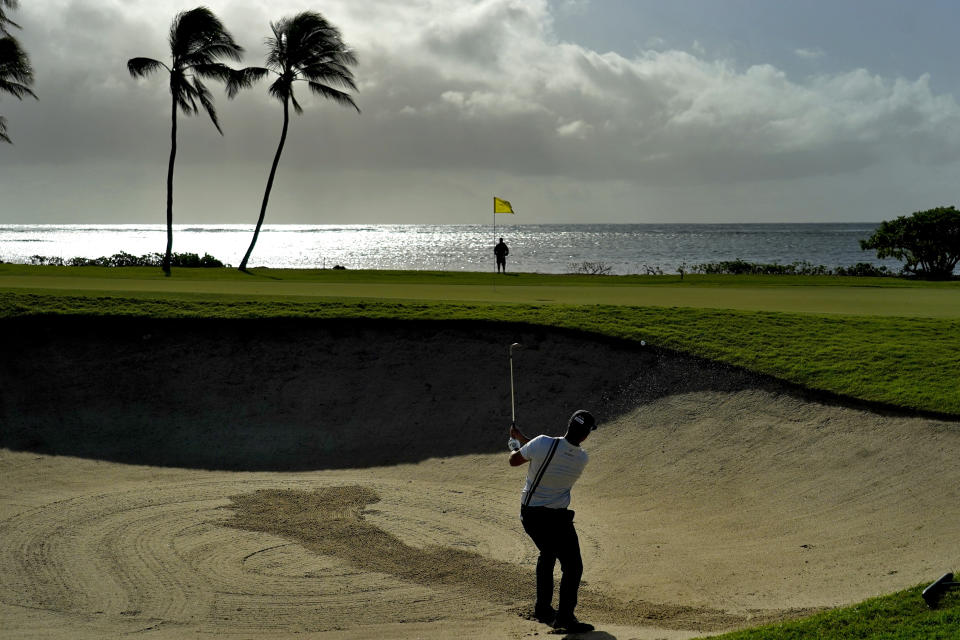 Scott Piercy hits out of the bunker on the 17th green during the second round of the Sony Open PGA Tour golf event, Friday, Jan. 10, 2020, at Waialae Country Club in Honolulu. (AP Photo/Matt York)