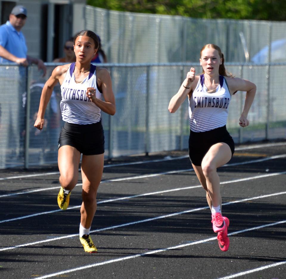 Smithsburg's Jenna Howe, right, and Alaina Pate, left, finished 1-2 in both the girls 100-meter dash and 200-meter dash. Howe also won the 400 as the Leopards rolled to the team title.