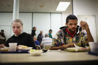 READING, PA - OCTOBER 20: An out of work couple eats lunch at the Central Park United Methodist Church which has a soup kitchen and food pantry on October 20, 2011 in Reading, Pennsylvania. The church feeds thousands of needy Reading residents monthly and relies on donations and volunteers to keep its increasingly popular programs operating. Reading, a city that once boasted numerous industries and the nation's largest railroad company, has recently been named America's poorest city with residents over 65,000. According to new census data, 41.3 percent of people live below the poverty line in Reading. Reading has about 90,000 residents, many of whom are recent Hispanic arrivals who have moved from larger eastern cities over the past decade. While a manufacturing base offering well paying jobs still exists in Reading, many companies like Hershey, Stanley Tool and Dana Systems have either moved elsewhere in the United States or to Mexico in search of cheaper labor. The number of people living in poverty in America, 46.2 million, is now at its highest level for the 52 years the Census Bureau has been keeping records. (Photo by Spencer Platt/Getty Images)