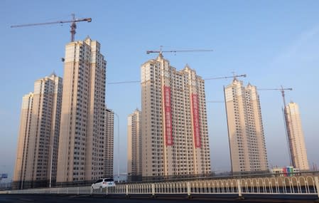 FILE PHOTO: Residential buildings under construction are seen in Jinpu New District in Dalian, Liaoning