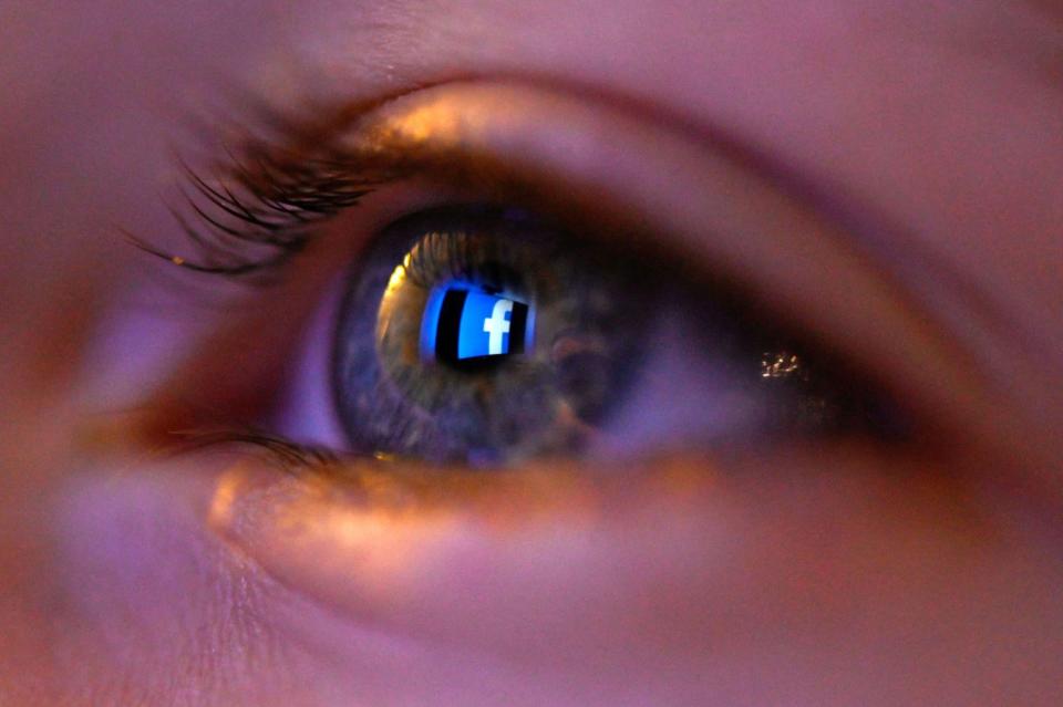 This illustration picture, taken on January 12, 2020 shows Facebook social network logo reflected on a eye in Rennes, western France: AFP via Getty