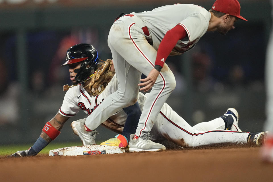 Atlanta Braves' Ronald Acuna Jr. steals second base ahead of the tag fromm Philadelphia Phillies shortstop Trea Turner (7) in the fifth inning of a baseball game Tuesday, Sept. 19, 2023. (AP Photo/John Bazemore)