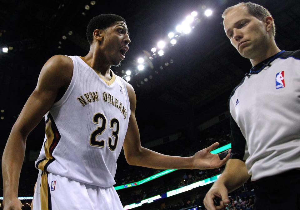 New Orleans Pelicans forward Anthony Davis (23) talks to an official during the first half of an NBA basketball game against the Boston Celtics in New Orleans, Sunday, March 16, 2014. (AP Photo/Jonathan Bachman)