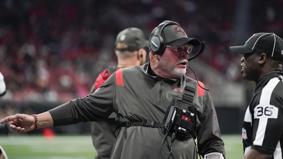 Tampa Bay Buccaneers head coach Bruce Arians speaks with an official during the second half of an NFL football game against the Atlanta Falcons, Sunday, Dec. 5, 2021, in Atlanta. (AP Photo/Brynn Anderson)