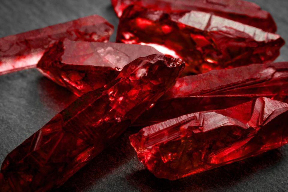 closeup of a bunch of red rough uncut ruby crystals