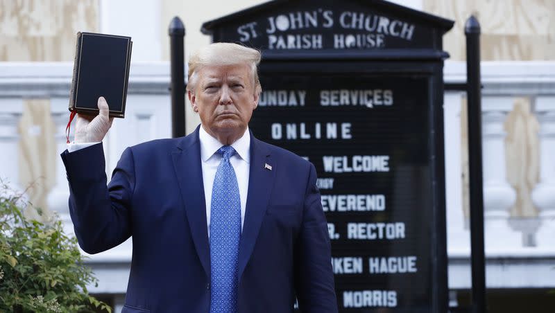 President Donald Trump holds a Bible as he visits outside St. John’s Church across Lafayette Park from the White House in Washington in this June 1, 2020, file photo.