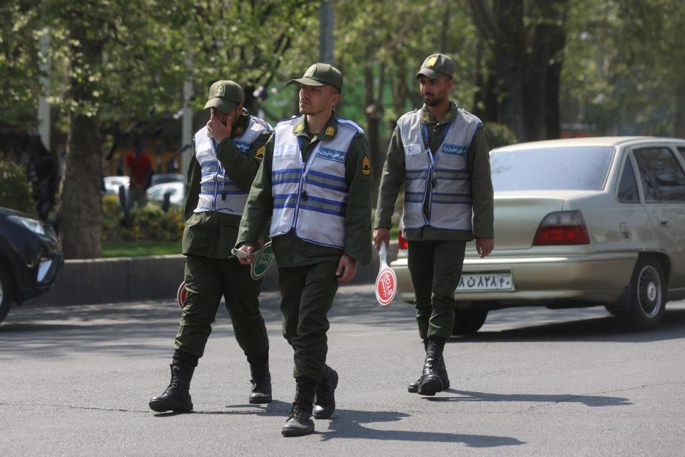Iran's police forces walk on a street amid the implementation of the new hijab surveillance in Tehran, Iran, April 15, 2023. Majid Asgaripour/WANA (West Asia News Agency) via REUTERS
