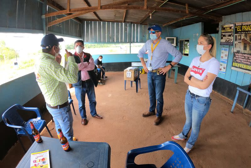 Cumaribo Mayor Juan Carlos Cordero talks to pilot Ernesto Perez and his companions before handing over samples of the coronavirus disease (COVID-19), in Cumaribo