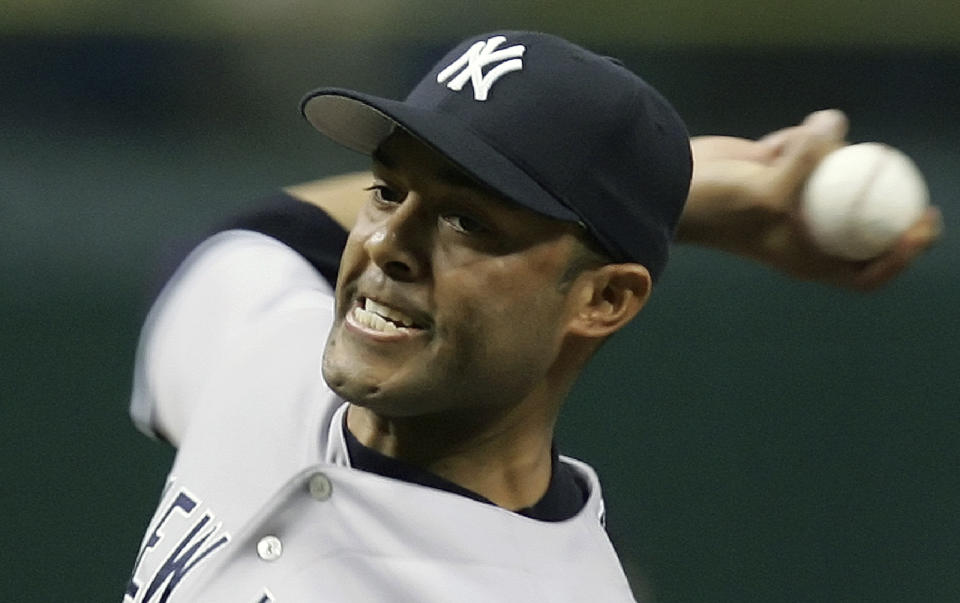 FILE - In this Sept. 25, 2006, file photo, New York Yankees pitcher Mariano Rivera throws a seventh inning pitch against the Tampa Bay Devil Rays during a baseball game in St. Petersburg, Fla. Rivera will be inducted into the Baseball Hall of Fame on Sunday, July 21, 2019. (AP Photo/Chris O'Meara, File)