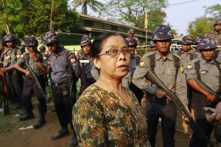 Khin Khin Yu, mother of student protest leader Moe Thway, talks to journalists in front of a court, where student protesters had arrived, in Letpadan March 11, 2015. REUTERS/Soe Zeya Tun