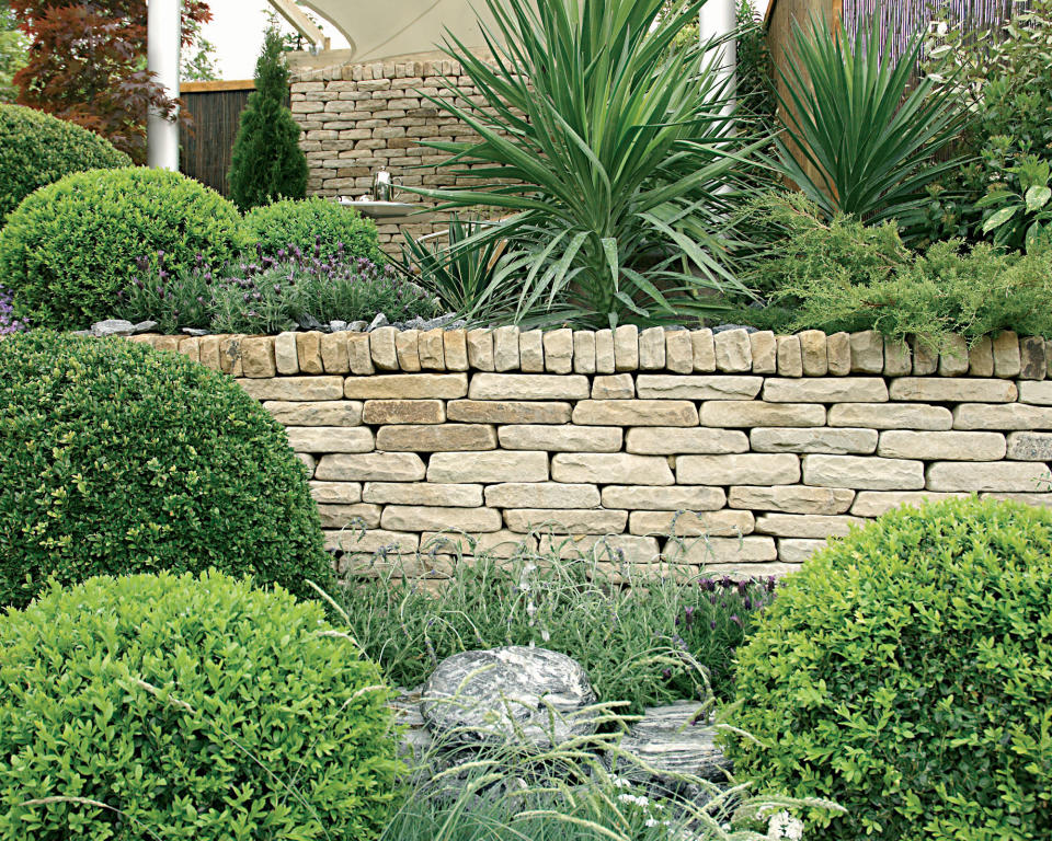 10. Add rustic charm with a dry stone wall