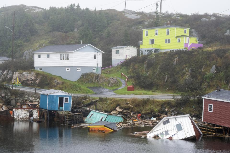 Buildings sit in the water along the shore following hurricane Fiona in Rose Blanche-Harbour Le Cou, Newfoundland on Tuesday, Sept. 27, 2022. Fiona left a trail of destruction across much of Atlantic Canada, stretching from Nova Scotia's eastern mainland to Cape Breton, Prince Edward Island and southwestern Newfoundland. (Frank Gunn/The Canadian Press via AP)