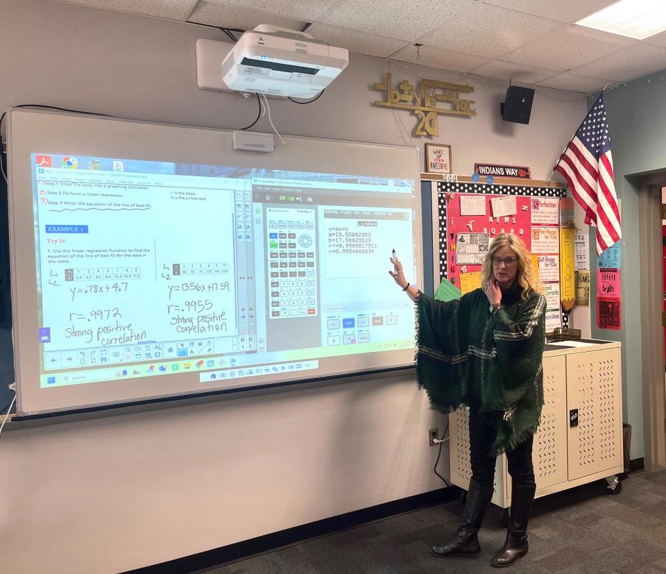 Conemaugh Township Area Middle/High School math teacher Tracy Durica demonstrates the use of an Epson Interactive Projector and a dry erase board in an Algebra class. This is part of the new technology the district plans to install in its middle and high school classrooms this year through a U.S. Dept. of Agriculture grant.