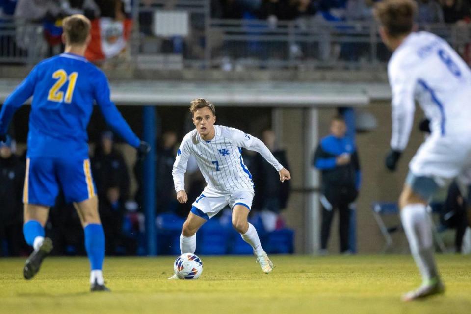 Kentucky midfielder Nick Gutmann (7) operates against Pittsburgh’s defense during Sunday night’s match. The senior provided the assist on the Wildcats’ only goal.