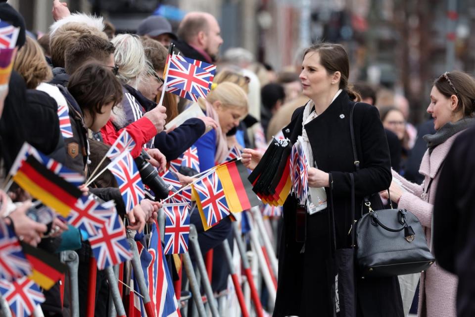 Crowds of Royalists were at the airport to greet Charles and Camilla on their first state visit (Getty Images)