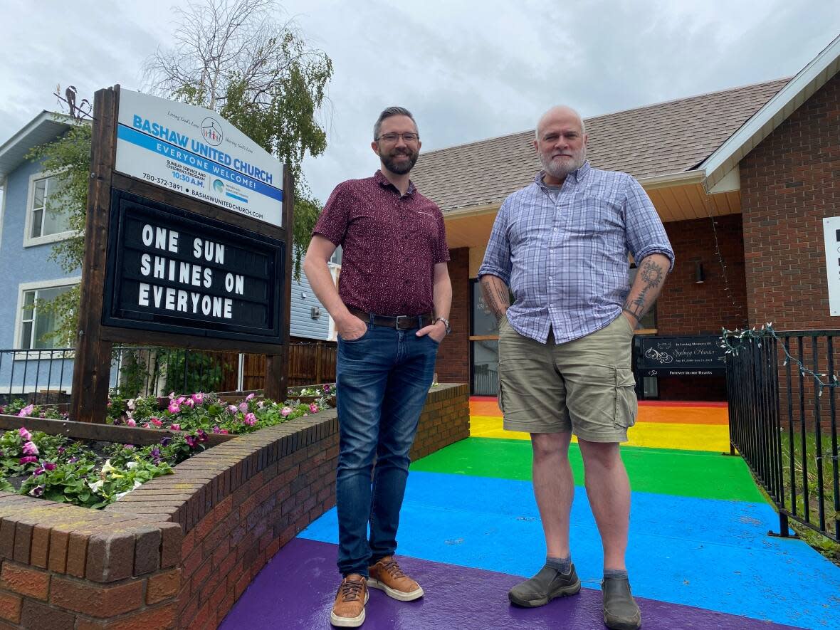 Bashaw church board chair Ben Wilson, left, and Rev. Robin King outside the Bashaw United Church. (Gabriela Panza-Beltrandi/CBC - image credit)