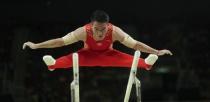 2016 Rio Olympics - Artistic Gymnastics - Final - Men's Parallel Bars Final - Rio Olympic Arena - Rio de Janeiro, Brazil - 16/08/2016. Deng Shudi (CHN) of China competes. REUTERS/Mike Blake