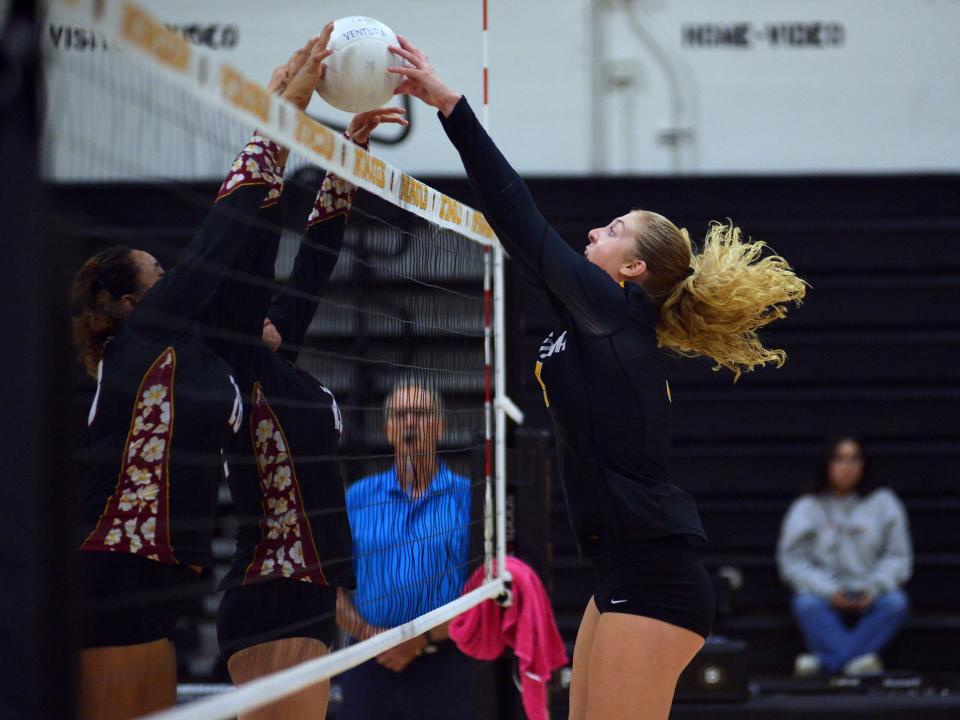 Ventura's Kate Duffey (right) battles two Oxnard players over the net during the Cougars' sweep of the Yellowjackets in a Channel League match on Tuesday night.
