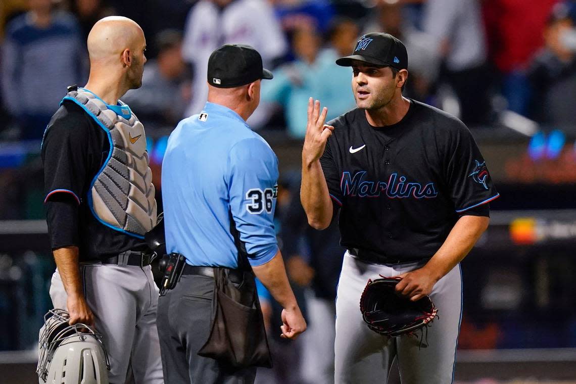 Miami Marlins relief pitcher Richard Bleier, right, argues with home plate umpire Ryan Blakney, center, after being ejected after the eighth inning of the team’s baseball game against the New York Mets on Tuesday, Sept. 27, 2022, in New York. The Marlins won 6-4. (AP Photo/Frank Franklin II) Frank Franklin II/AP