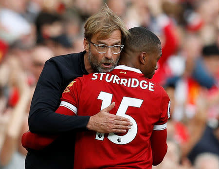 Soccer Football - Premier League - Liverpool vs Manchester United - Anfield, Liverpool, Britain - October 14, 2017 Liverpool's Daniel Sturridge with Liverpool manager Juergen Klopp before coming on as a substitute REUTERS/Phil Noble