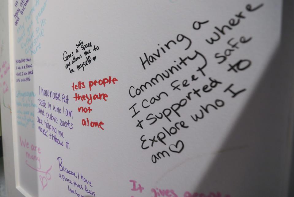 Messages from LGBTQ+ community members about their experiences are seen in the "Telling Our Stories" exhibit on Thursday at the Neville Public Museum in Green Bay. The exhibit highlights the LGBTQ+ community's history in the Green Bay area.