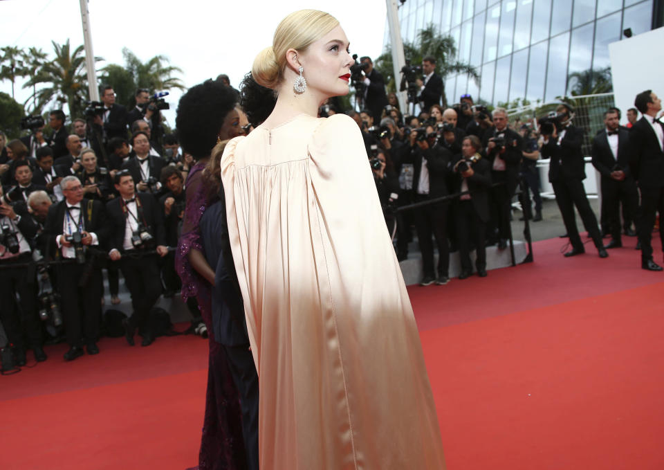 Jury member Elle Fanning poses for photographers upon arrival at the opening ceremony and the premiere of the film 'The Dead Don't Die' at the 72nd international film festival, Cannes, southern France, Tuesday, May 14, 2019. (Photo by Joel C Ryan/Invision/AP)